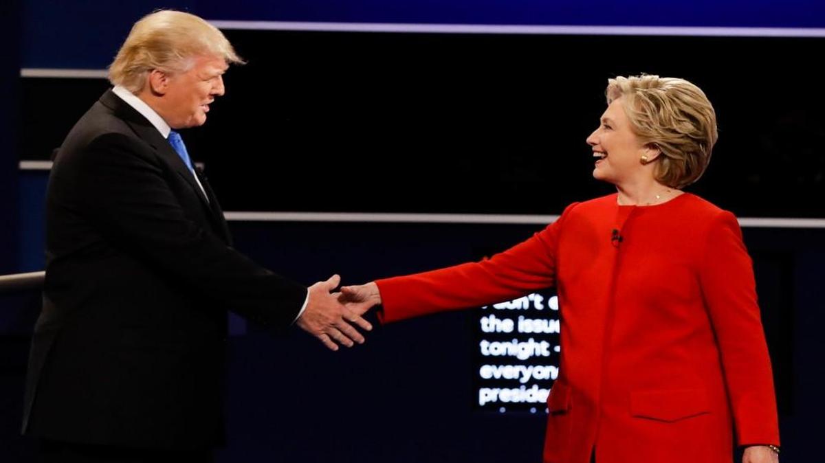 Republican presidential nominee Donald Trump and Democratic presidential nominee Hillary Clinton shake hands during the presidential debate on Monday night. Where do you stand on the presidential race?