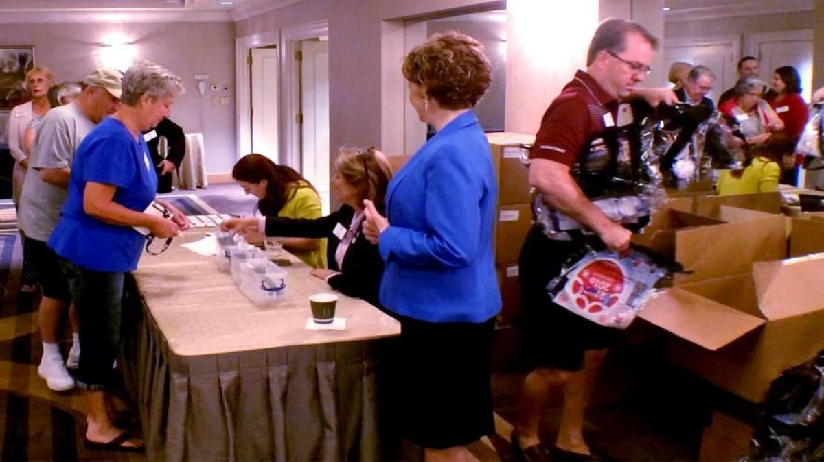 Republican delegates register and receive goodie bags, with a nod to security.