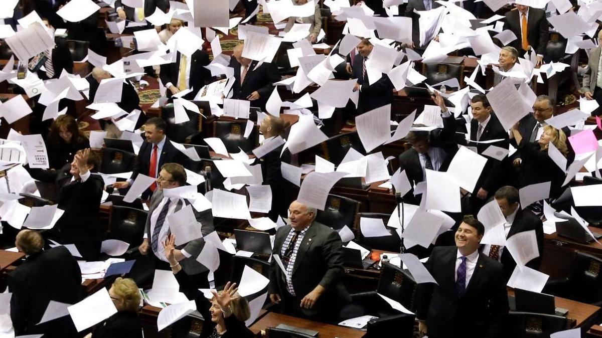 Members of the Missouri House threw papers in the air at the conclusion of the legislative session Friday in Jefferson City.
