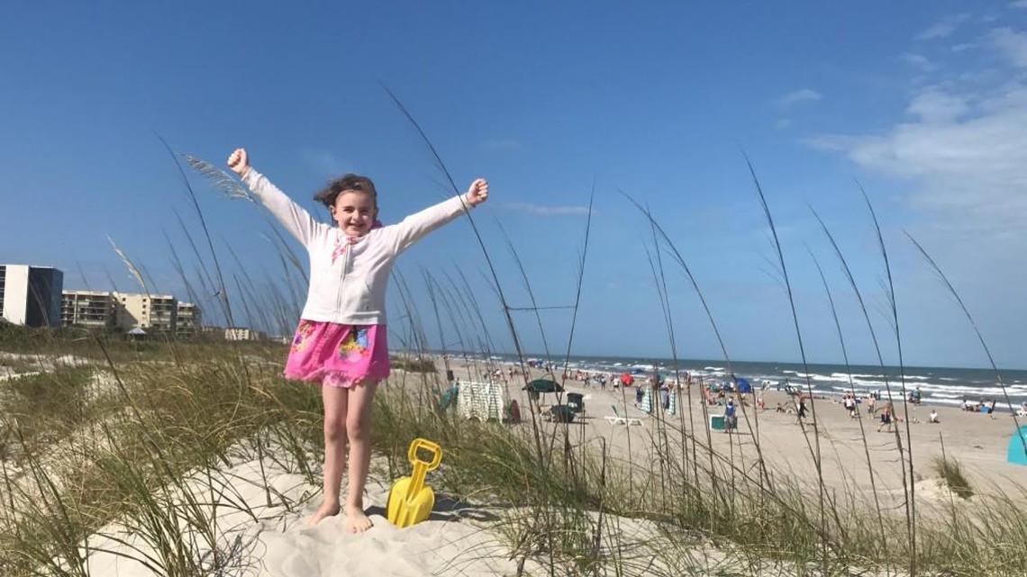 Olivia Hansen, 7, of Olathe enjoying a Florida beach in March, after being the first to receive a second wish from a new charity, Sporting Wishes.