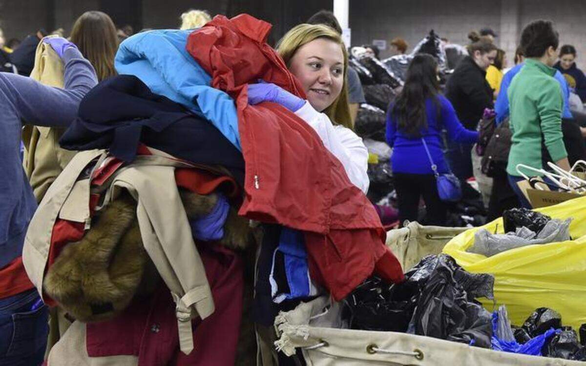 
Volunteer Kelsie Barnes, a Sigma Society member from Northwest Missouri State University, helped Project Warmth on Saturday at a West Side warehouse. 
