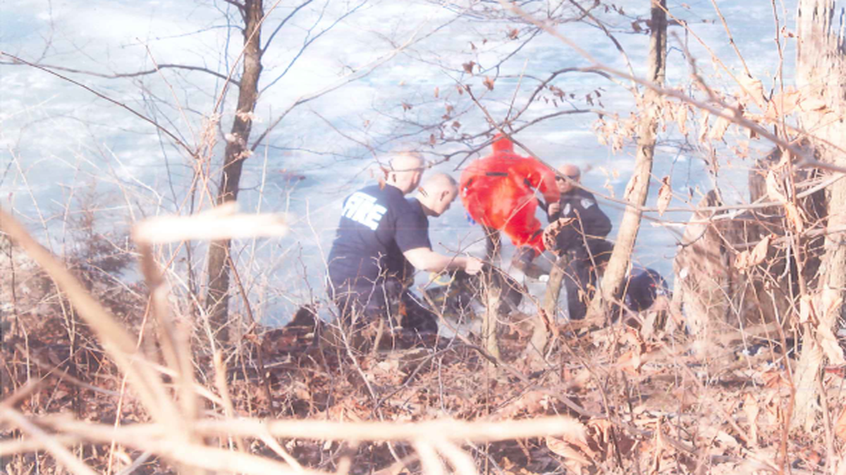 Brian Flavin, an Independence police officer leaving an assignment, heard a radio call Sunday and rescued a teenager who had fallen through the ice of a pond just south of a Bass Pro Shops store.