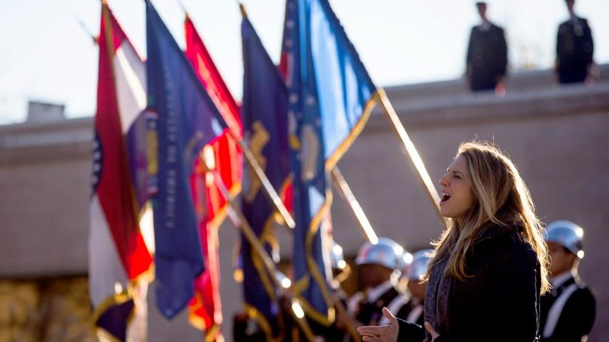 Janine Stange sang during the Veterans Day salute at the Harry S. Truman Library in Independence on Sunday.