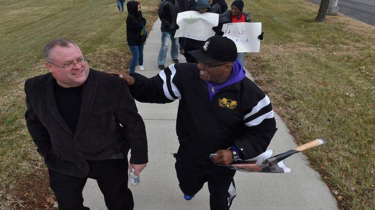
During a peaceful demonstration Wednesday along Brush Creek Boulevard, Rodney Hammer of Lee’s Summit (left) and Mike Patton of Kansas City led marchers. The march ended in front of the J.C. Nichols Fountain near the Plaza.
