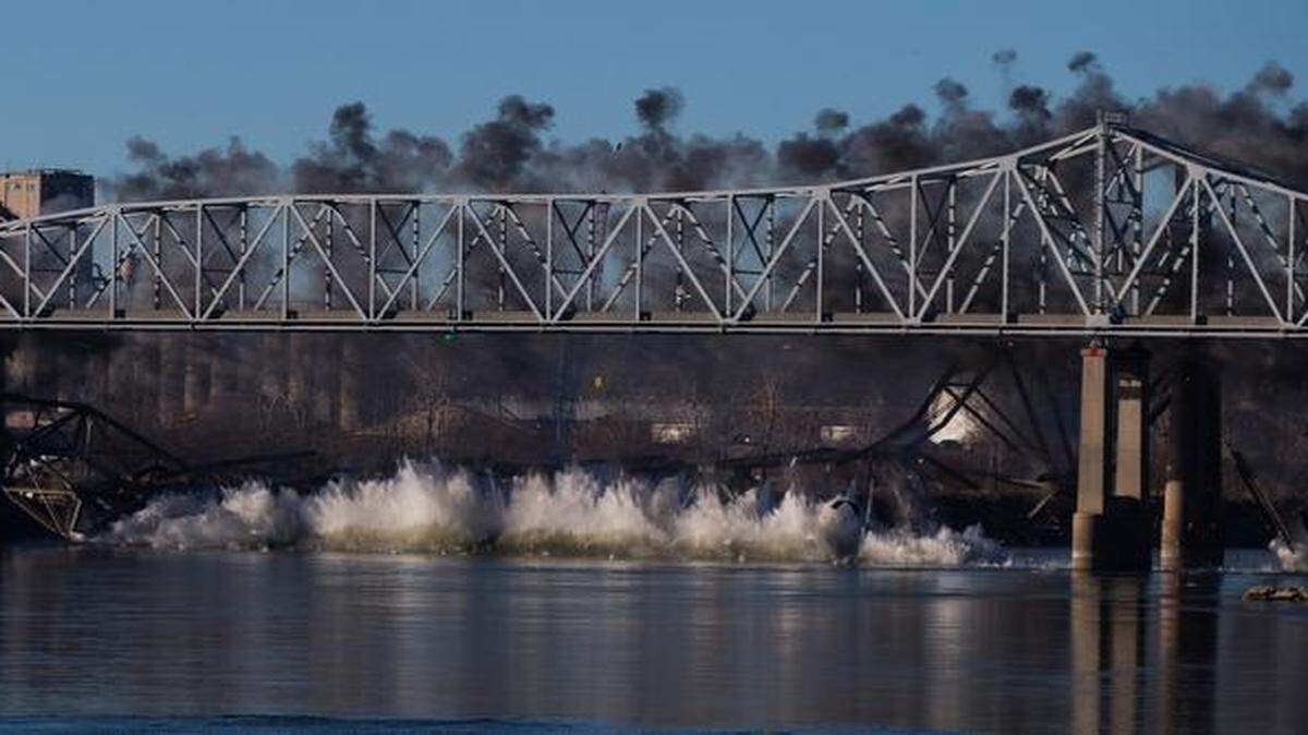 
The main span of the Fairfax Bridge falls into the Missouri River on Saturday after workers from American Bridge set off explosives to demolish it.
