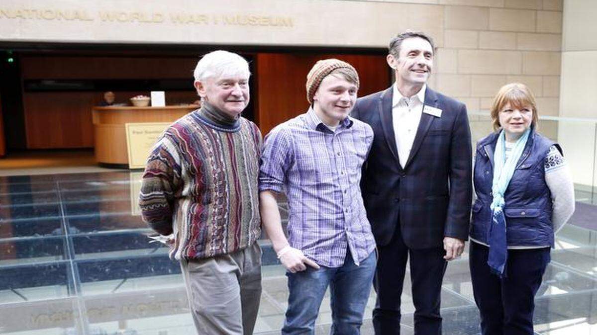 
Scott Jemison, second from left, won a prize package for breaking the attendance record at the National World War I Museum. With him are his parents, Tom and Sandy Jemison and museum President Matthew Naylor (second from right.) 
