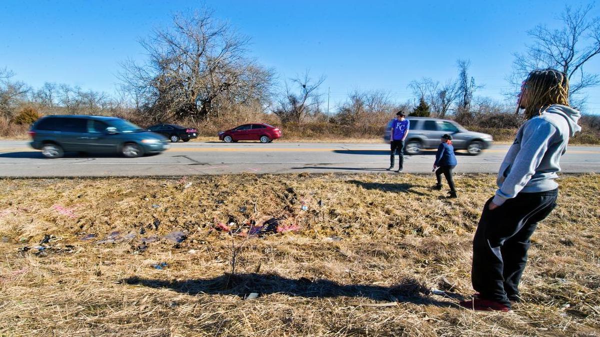 Friends of the victims of Monday’s fatal accident on Pryor Road in Lee’s Summit gathered Tuesday at the scene. They included (from foreground) D.J. Robinson Jr., Amanda Purvey and Adam Williams.