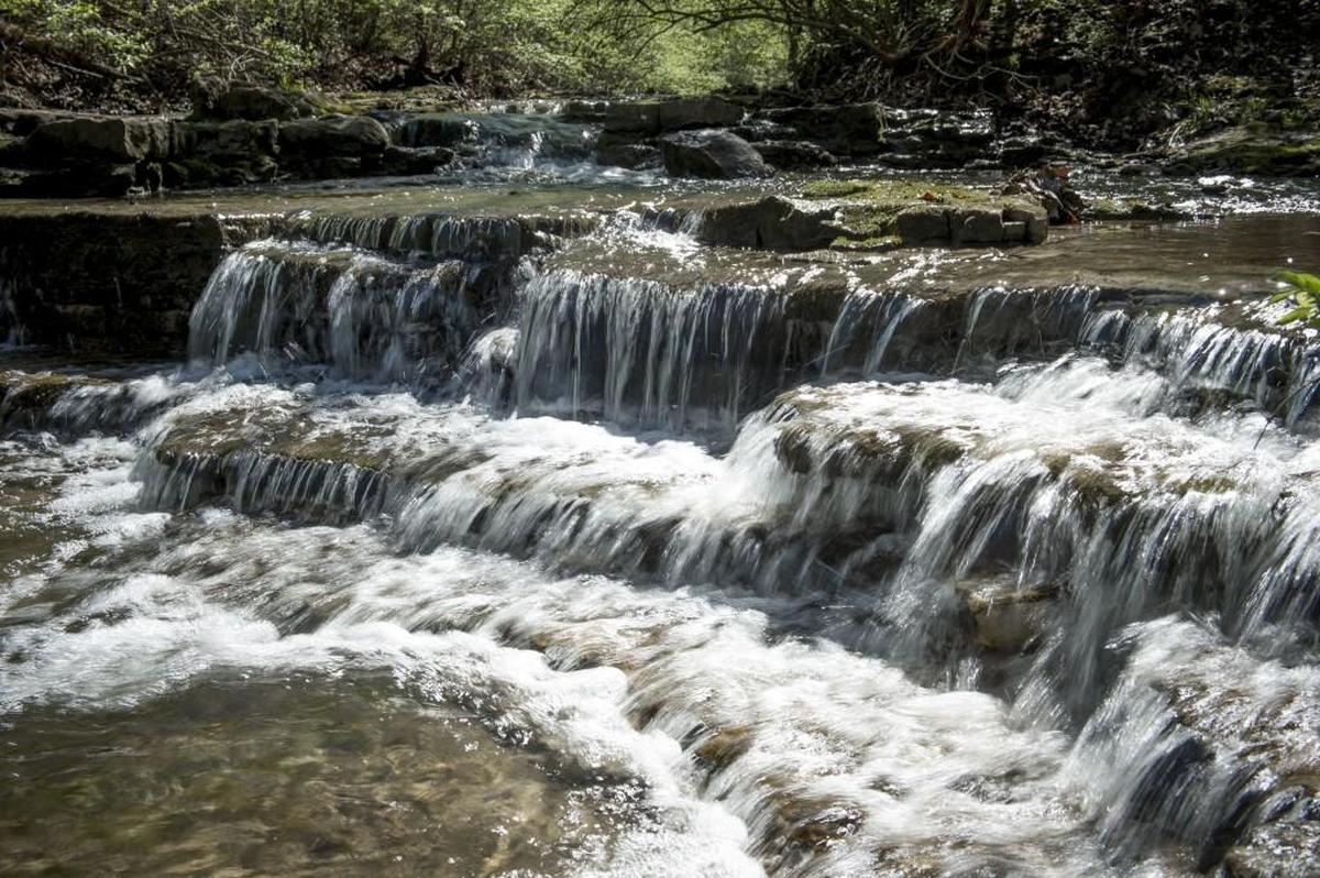 Water falls over rock ledges not far from the bridle trail at Wyandotte County Lake Park.
