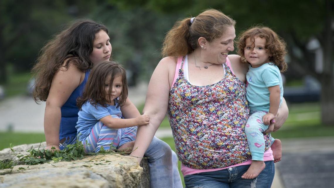 
Since being cited for shoplifting Monday, Sarah Robinson and her children, including Angelina Romero (from left), Bellasara Aguilar and Becky Aguilar, have been helped by Roeland Park police officer Mark Engravalle and many others in the area.
