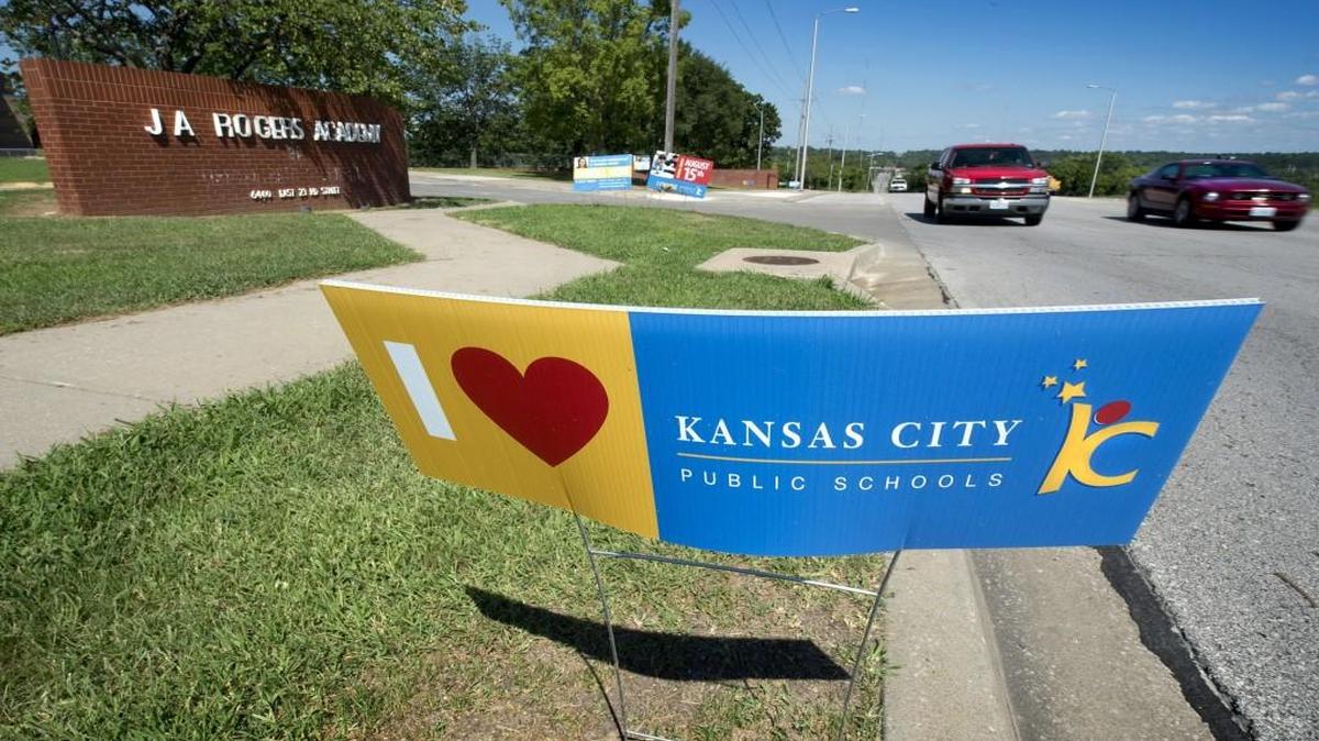 Signs and a banner outside J.A. Rogers Elementary School , 6400 E. 23rd St., encourage parents to get their children enrolled. Similar signs and banners are going up all around Kansas City as the school district aims to boost numbers.