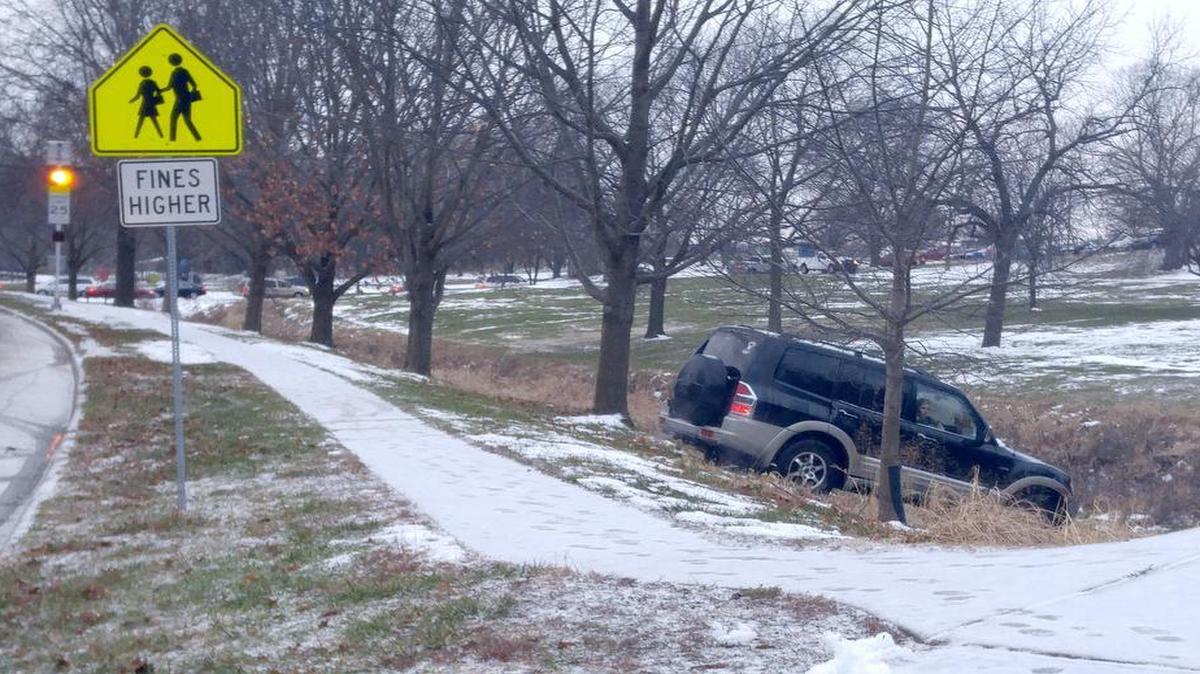 Students returned to school in Olathe on slick roads Wednesday morning. One vehicle almost slid into Indian Creek near Heritage Elementary.