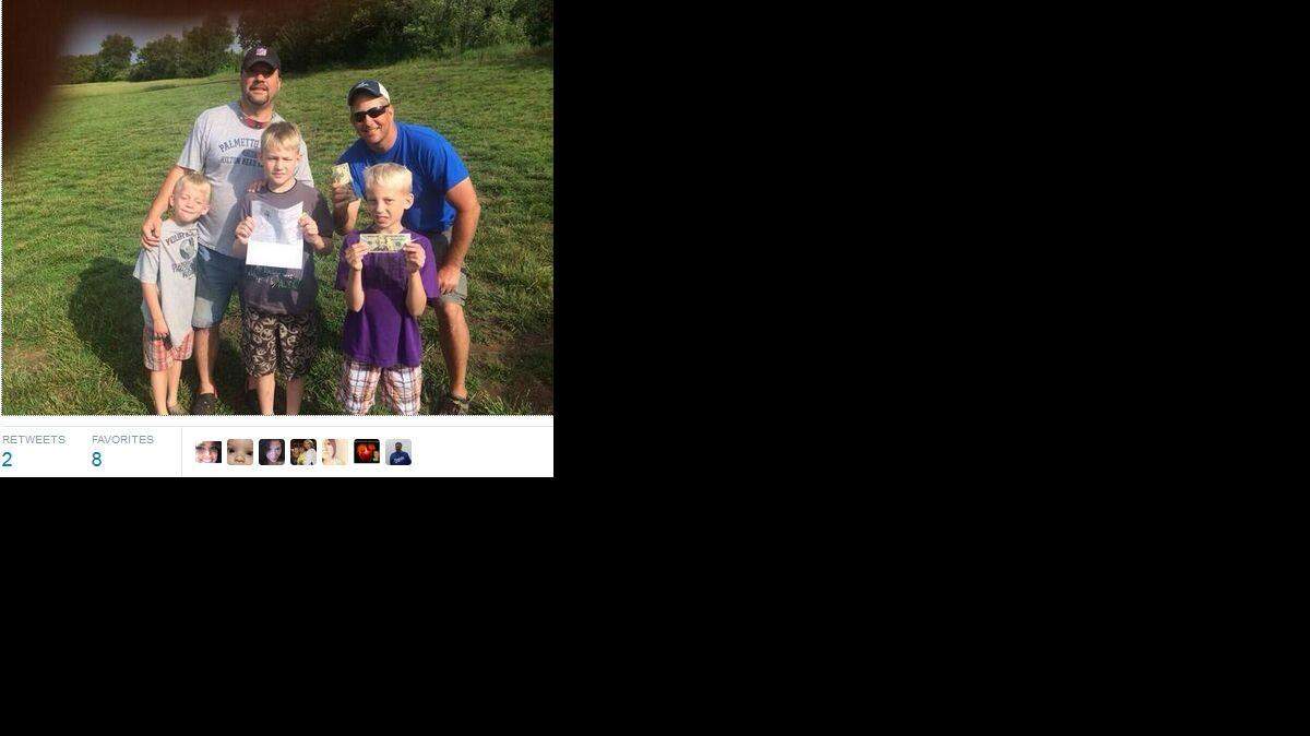 
About 9 a.m., Jeff White, using the Twitter name JeffWhite111, announced he found it. An attached photo showed two men with three boys holding a letter and cash.
