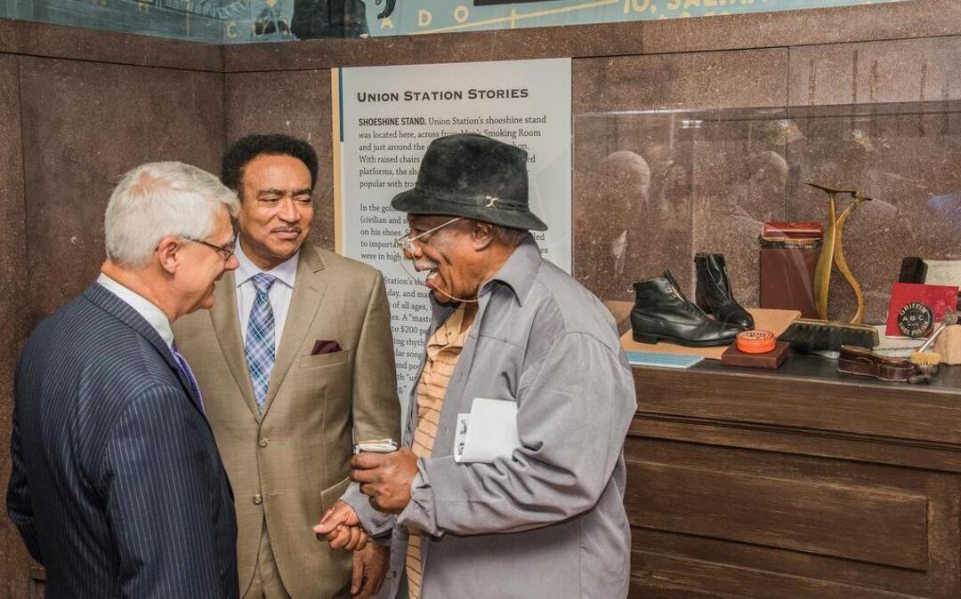 
A new exhibit honoring the once ubiquitous shoeshine stand was unveiled Thursday at Union Station. An original shiner, Sonny Gibson (right), described the job to Union Station board chairman Bob Regnier (left) and Henry Lyons.
