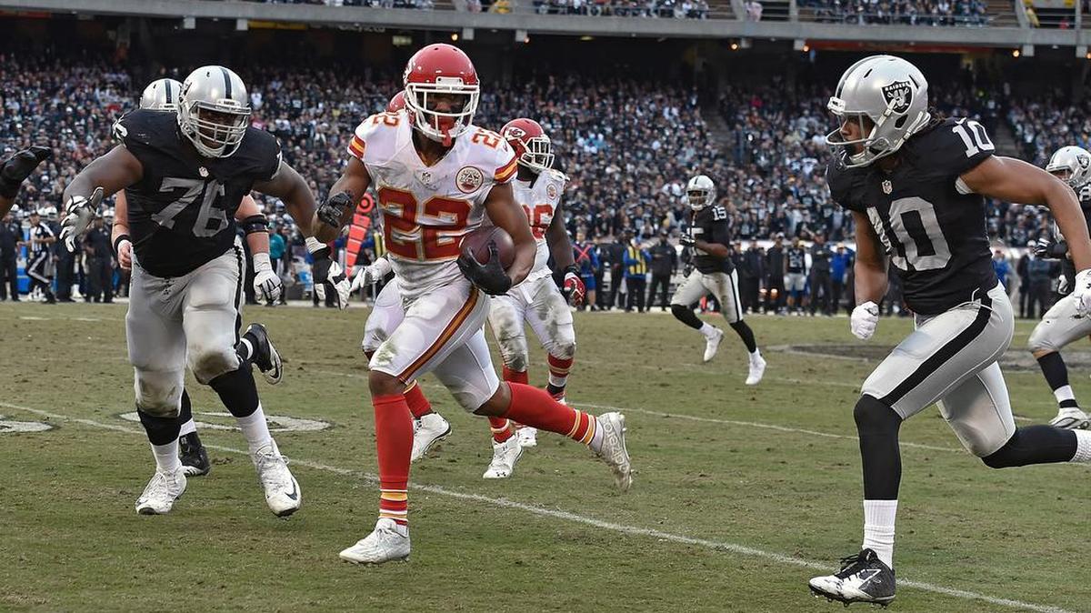 Kansas City Chiefs cornerback Marcus Peters (22) returns an interception 58-yards past Oakland Raiders wide receiver Seth Roberts (10) and offensive guard J'Marcus Webb (76) to the 13 yard line in the fourth quarter during Sunday's football game on December 6, 2015 at O.co Coliseum in Oakland, Ca.