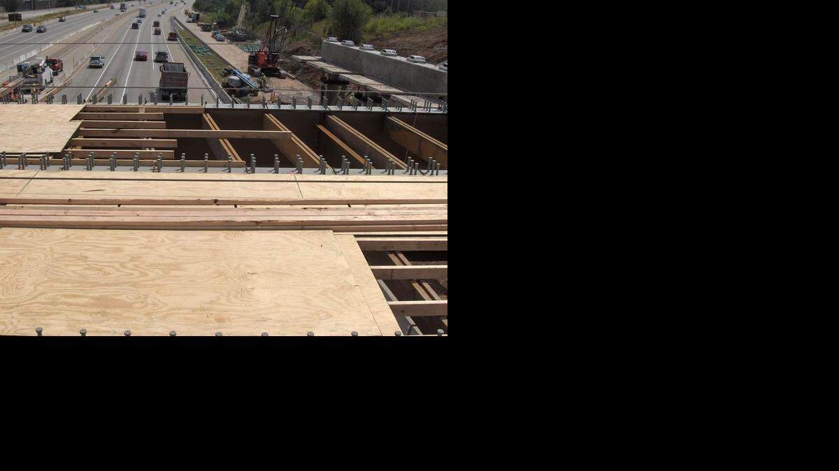 
Drivers should expect delays along the southern loop of Interstate 435 while the highway is closed on Friday and Saturday nights so crews can lift girders in place for the new Roe Avenue interchange.
Bridge girders are already in place on one of the two new bridges. The pier caps at the top right are awaiting the girders that will be lifted into place overnight on Friday and Saturday.

