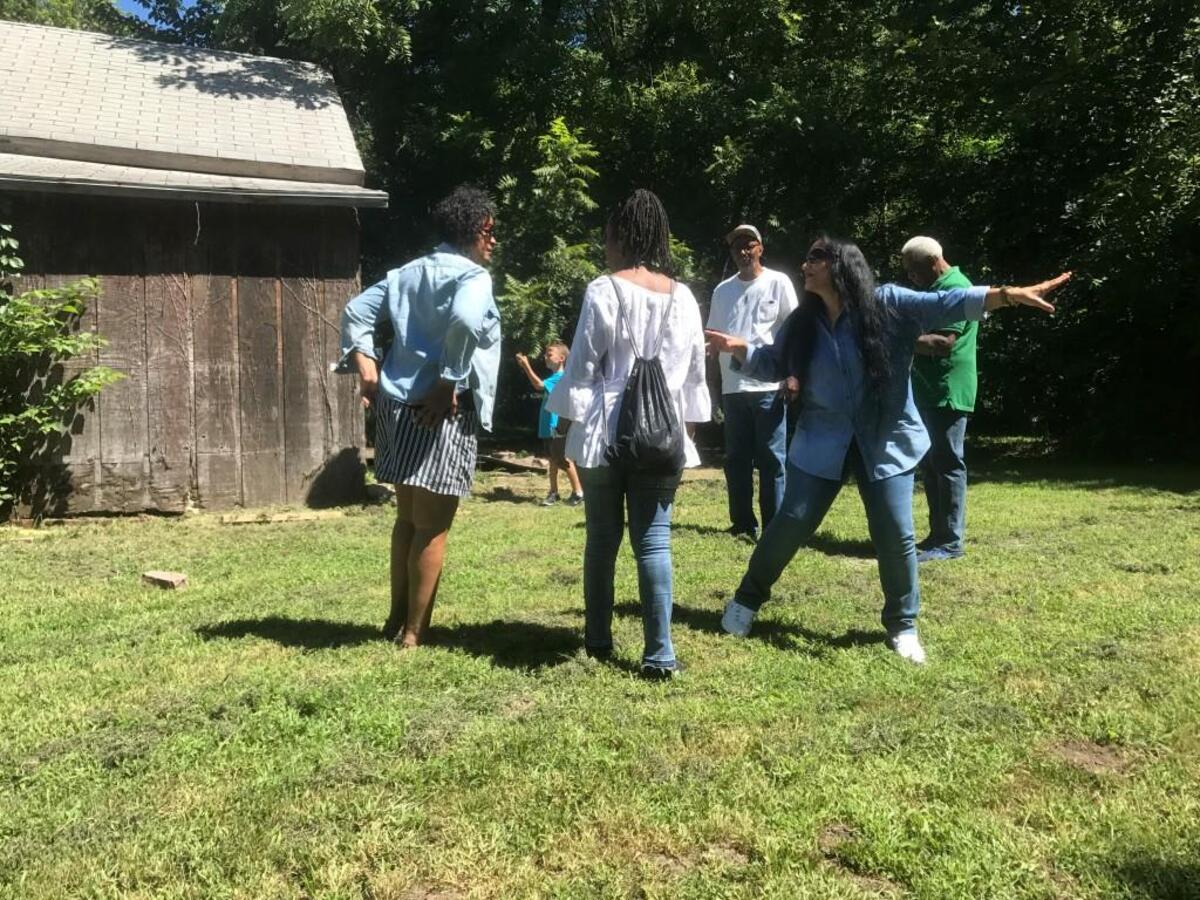 Joyce Groves Holland, right, points out a part of Walter Groves’ land to her family members. Walter was the son of the “Potato King of the World,” Junius Groves.