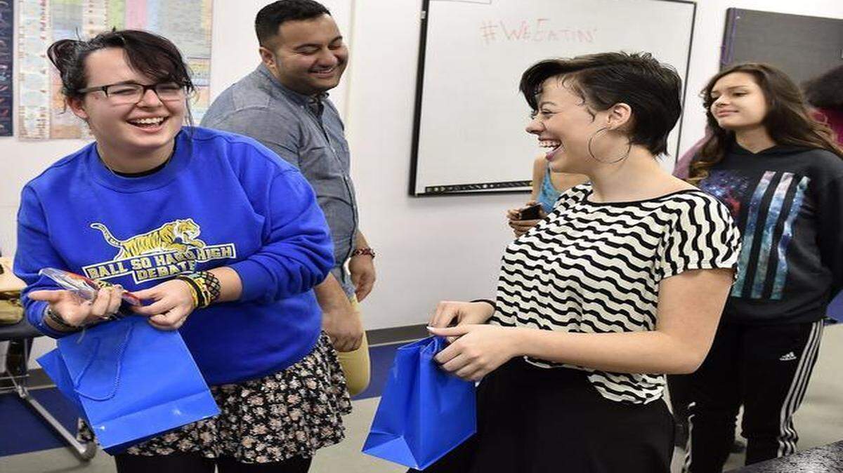 
Two debaters from Lincoln College Preparatory Academy — Ellen Baker (left) and Monica Medeiros — ran undefeated past powerhouse teams from Blue Springs, Lee’s Summit and Pembroke Hill to win the policy debate event in the Show-Me National Speech and Debate Association district championships. The team, including coach Sohail Jouya (center), recently celebrated their success.
