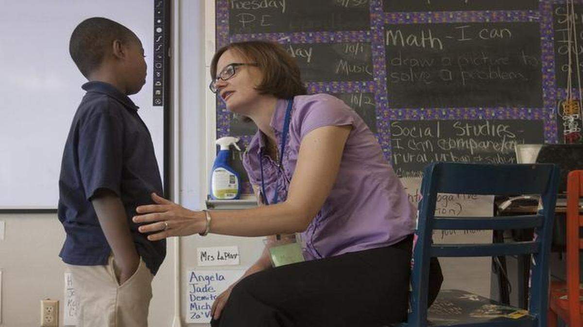 
Third-grade teacher Emily LaPlant helped Omar Ismail go through his “power plan,” an individualized tool used at Garfield Elementary School to help students and teachers overcome stress. The strategy is part of a trauma-sensitive program being tested in Kansas City. 
