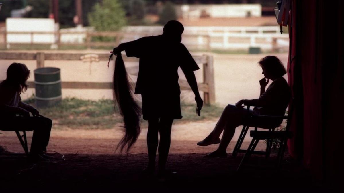 Kristen Conroy of Statesville, N.C., brushed out a switch, or a fake horse tail, in the barn at the Hunt Horse Complex several years ago. Local horse owners who have had their horses’ tails cut off and stolen by thieves worry the hair may being used to make hair extension for show horses.