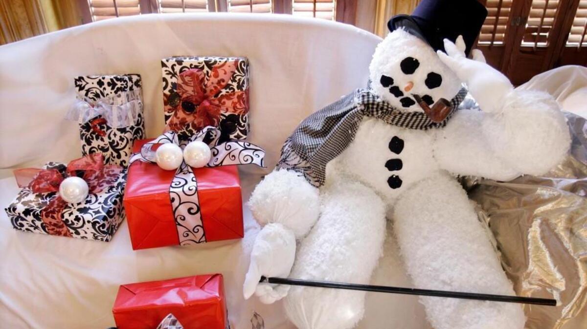 A snowman decoration looks perplexed in a home in 2010.