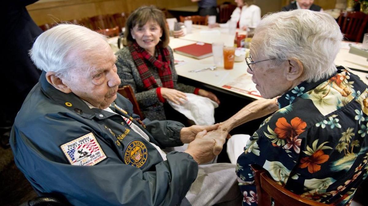 Pearl Harbor survivors Dorwin Lamkin, 93, of Shawnee, (left), greeted Edmund Russell, 98, of Lenexa, at a luncheon on the 74th anniversary of the attack on Pearl Harbor, which was remembered on Monday, Dec. 7, 2015, at a small luncheon in Prairie Village that included the survivors, family, and friends. A moment of silence was held at 11:55 a.m., the time in Kansas City the attacks began. Lamkin served in the Navy aboard the U.S.S. Nevada. Russell served as a butcher in the U.S. Army Air Corps during the attack. Lamkin's longtime family friend, Judy Talbott, (center) of St. Louis came for the event.