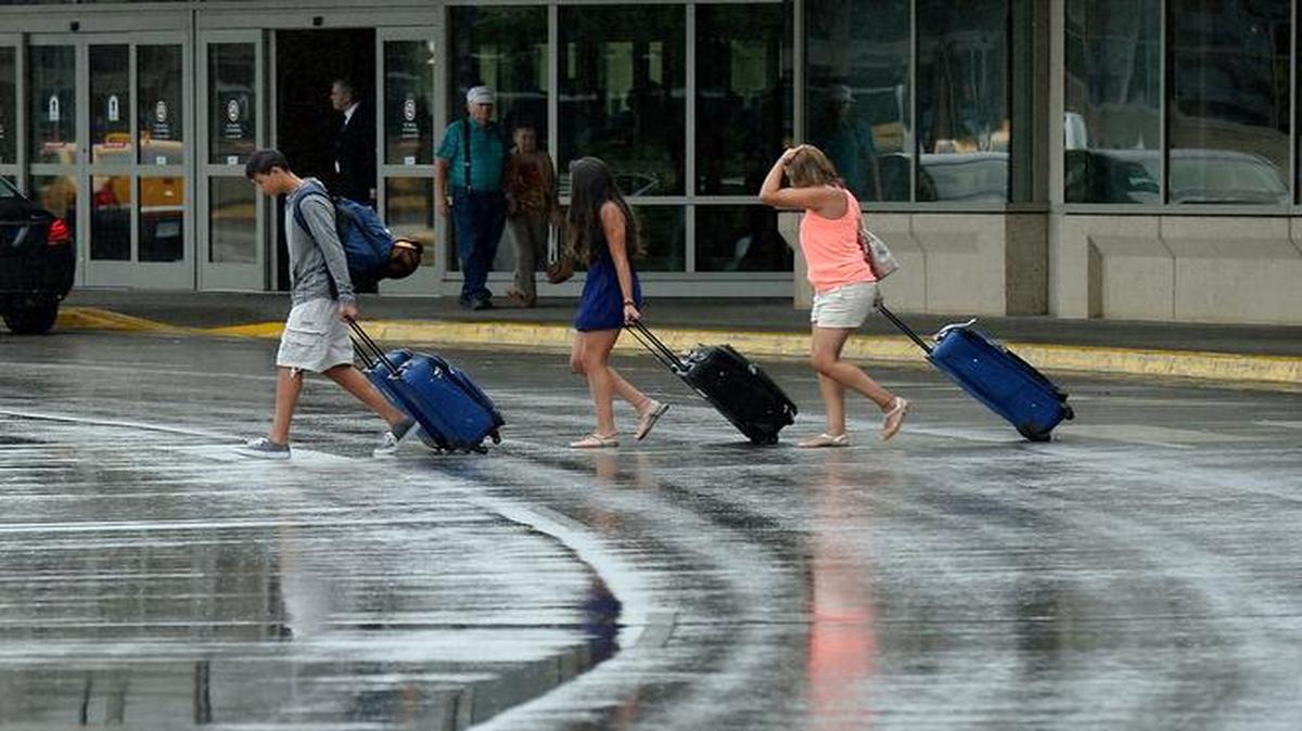 
Travelers departed Kansas City International Airport over rain-slick streets Wednesday. Cool, wet weather blanketed much of the Kansas City area, bringing high temperatures not expected to top 70 degrees.
