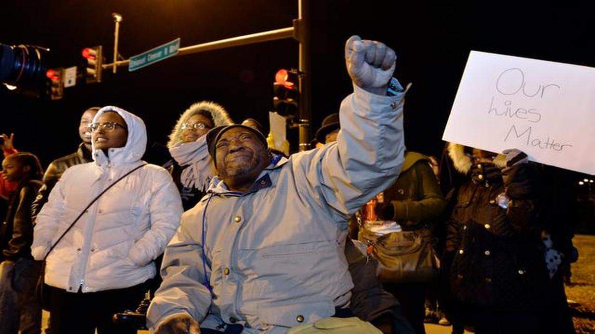 Protesters gathered Tuesday at Emanuel Cleaver II Boulevard and Prospect Avenue in Kansas City to decry the grand jury decision in the Ferguson, Mo., case. Verdell Ford of Kansas City and others chanted, “No justice, no peace!” at the rally.