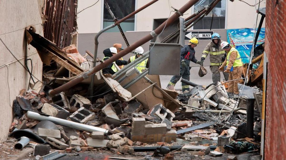 
Investigators examined the damages after the explosion that destroyed JJ’s restaurant in Kansas City. 
