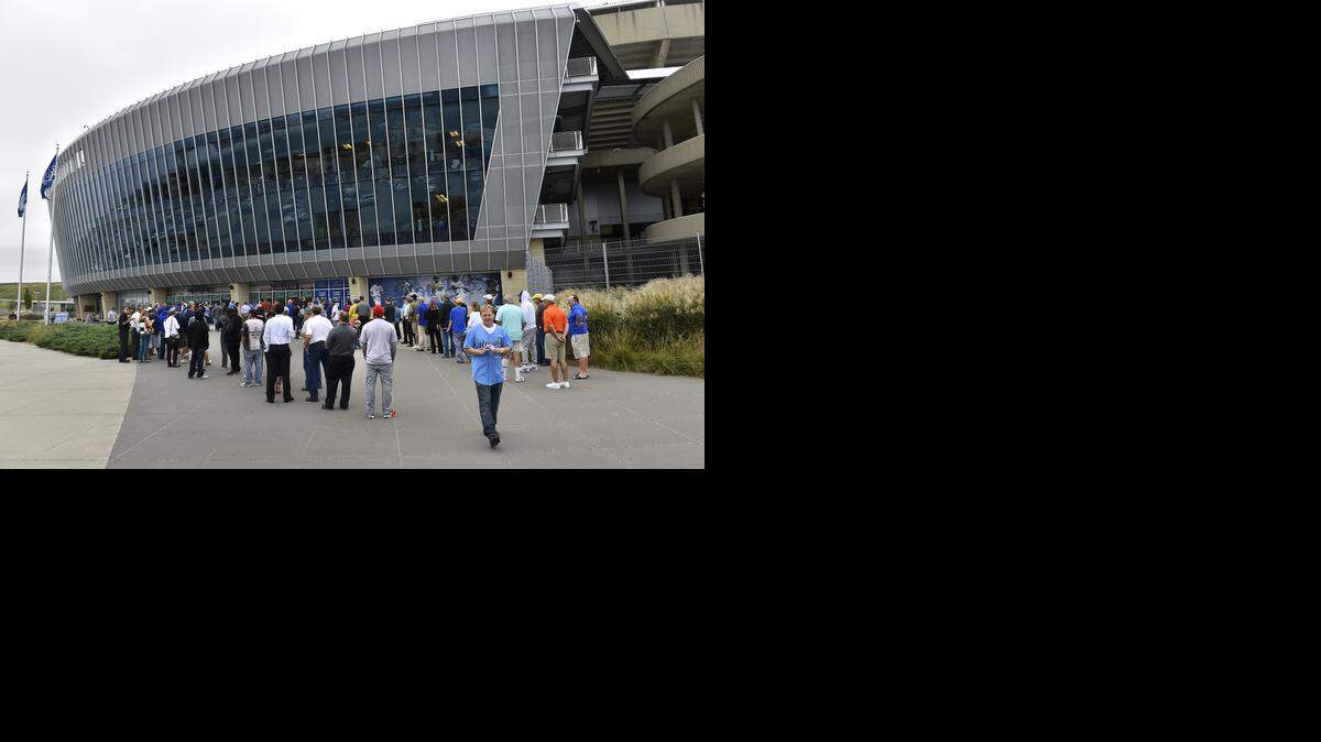 
Royals fans lined up to buy tickets at Kauffman Stadium Thursday, Sept. 18, 2014, for a possible postseason appearance by the team. Fans got wristbands allowing them to queue up in sequence after a number that was called out.
