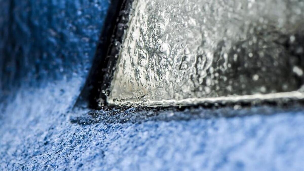 People in the Kansas City area woke to freezing rain and ice on Tuesday. Pictured is a car headlight covered in ice.