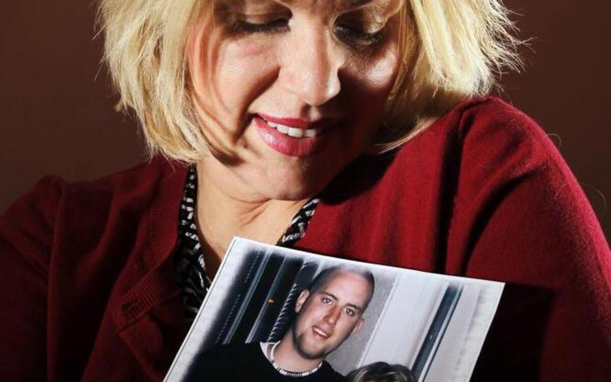 
Lisa Battagliola held a picture of her son, Josh Langton, on May 5, 2011. 
