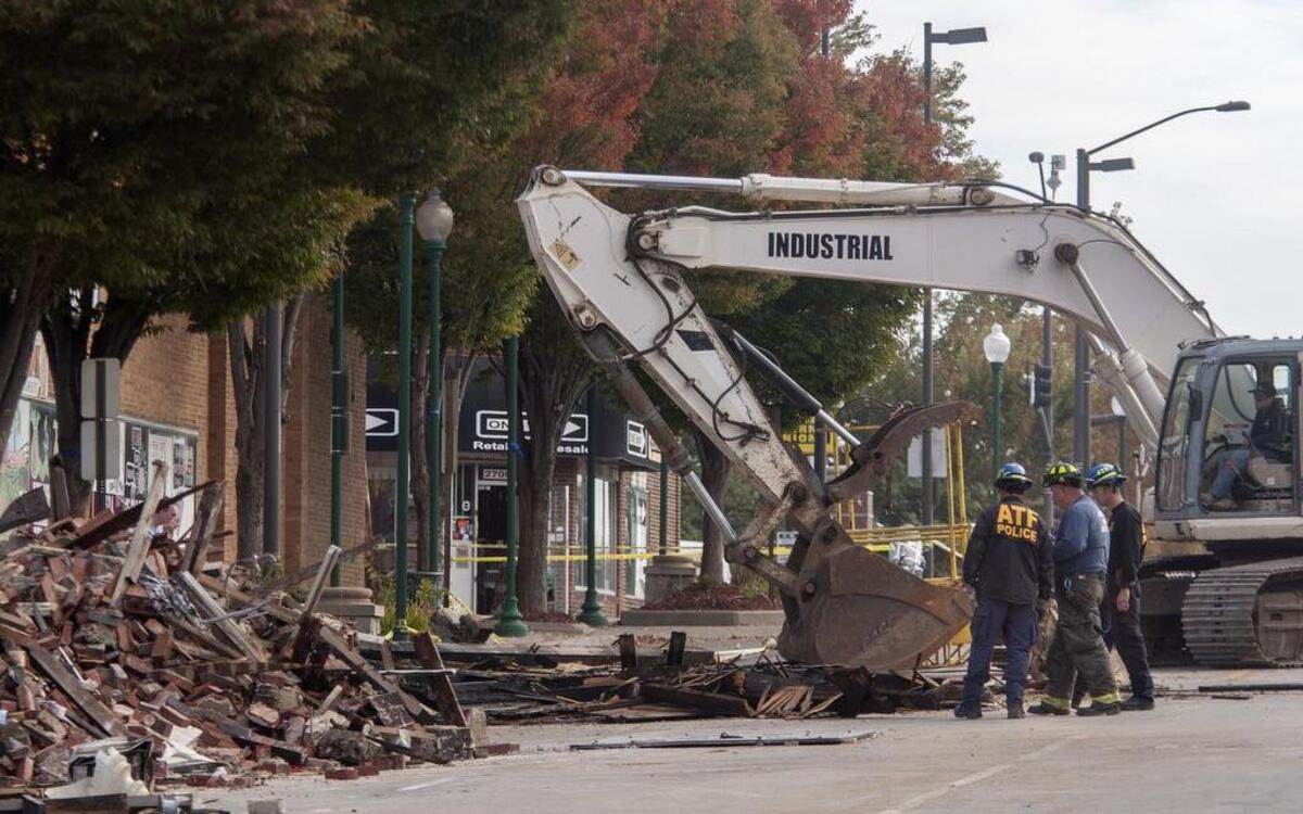 
Investigators with the Bureau of Alcohol, Tobacco, Firearms and Explosives helped sift through debris from the fatal fire on Independence Avenue with the help of large excavators Thursday.
