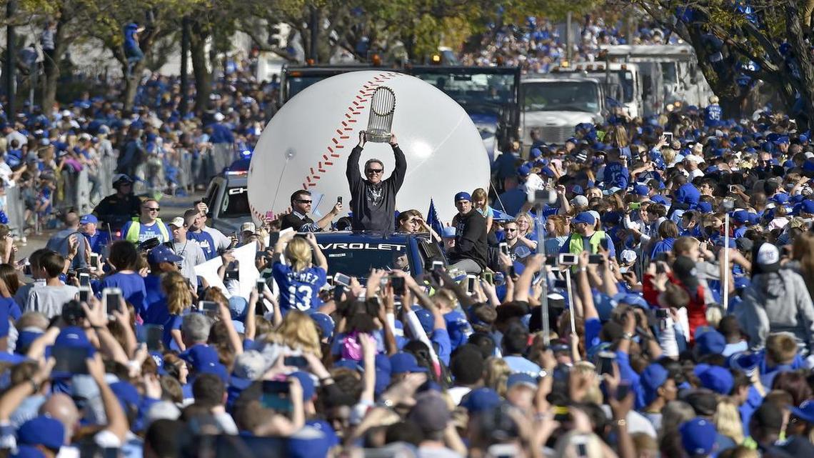 Kansas City Royals manager Ned Yost carries the trophy during Tuesday's Kansas City Royals baseball World Series parade and celebration on November 3, 2015 at Union Station in Kansas City, Mo.