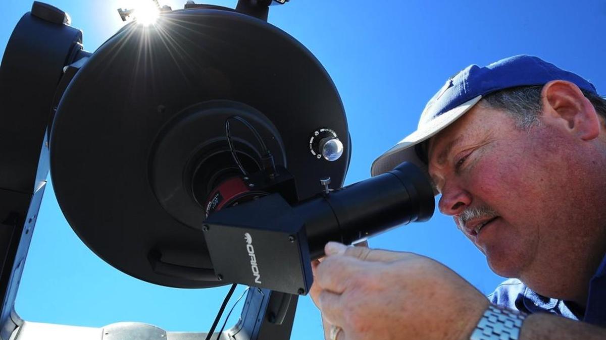 Joseph Wright, operations manager for the Warkoczewski Observatory at the University of Missouri-Kansas City, made adjustments Sunday to a large reflector telescope to focus in on solar flares for guests to view. The observatory held an event Sunday that included a presentation about next year’s total solar eclipse that will be visible in Kansas City.