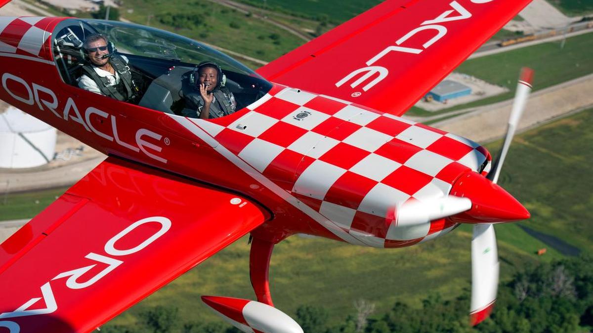 
A Kansas City youngster took his first airplane flight on Thursday, Aug. 20, 2015, through the Experimental Aircraft Association's Young Eagles program. Jedidiah Huskey, 12, waved at his dad in a follow plane during a flight with stunt pilot Sean D. Tucker, who is in town for the Kansas City Aviation Expo and Air Show at the Wheeler Downtown Airport. Nearly 2 million kids have been introduced to flight through the program which began in 1992.
