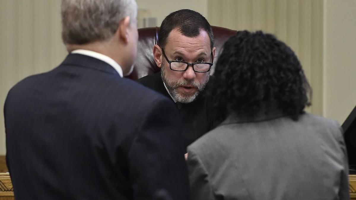 Before the third day of the Jacole Prince child endangerment trial, Circuit Court Judge J. Dale Youngs met with attorneys to discuss legal issues that led to an early recess Tuesday. On Tuesday, Prince, the defendant, exhibited emotional distress during the appearance of her daughter, LP, causing Curt Winegarner, her Missouri Public Defender, to be concerned about her mental state. A physician prescribed medication. On Wednesday, Nov, 18, 2015, Judge Youngs (center) asked Prince if she was feeling better and decided that court would resume. Her lawyer Curtis Winegarner (left) listens.