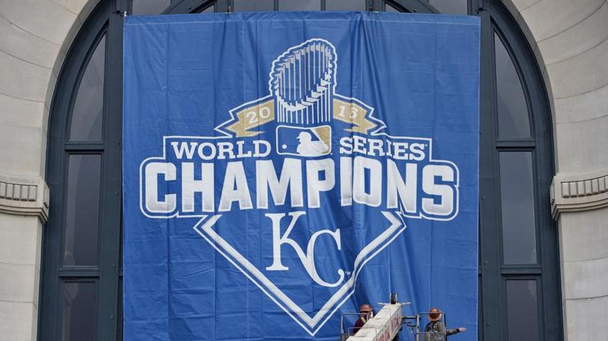 In preparation for Greater Kansas City Day, Robert Wood (left) and Loyd Hurst (folo) hung a banner honoring the Royals and their 2015 World Championship outside of Union Station on Thursday, March 31, 2016, in Kansas City. On Friday, Union Station will host host a free First Pitch party from 6:30 a.m. to 10 a.m. featuring a former Royals player, former Chiefs player, music and the World Series trophy. An aerial formation flyover by BeechNutz Flying Formation Group will do a flyover between 7:30 and 8:30 a.m. outside the station.
