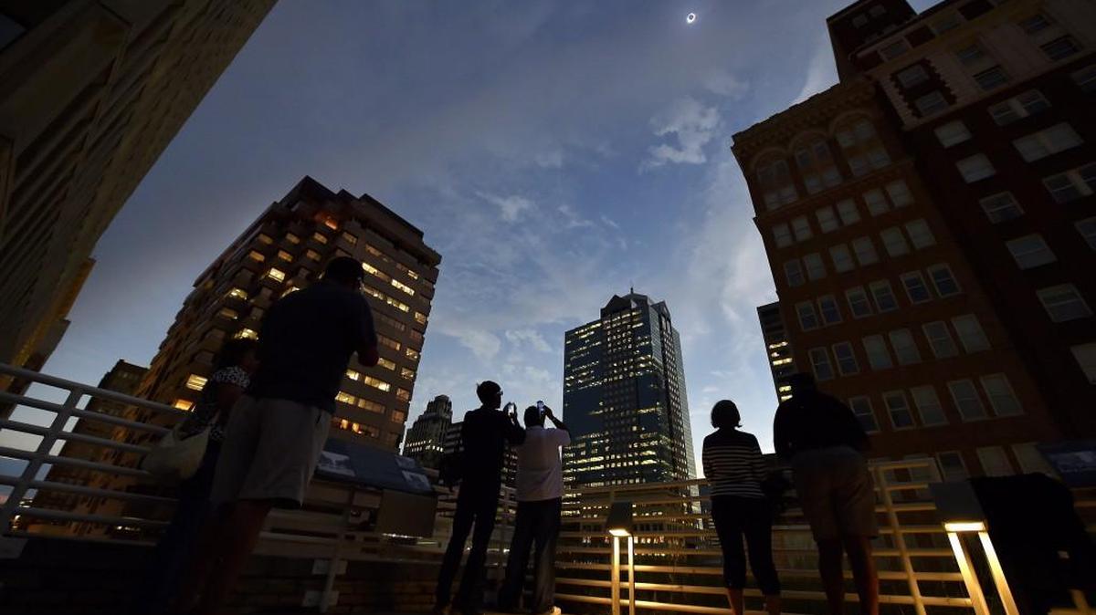 The weather should be close to ideal for folks in Kansas City to watch the partial solar eclipse. In 2017, people watched from the top of the Kansas City Public Library as the total eclipse of the sun darkened downtown Kansas City.