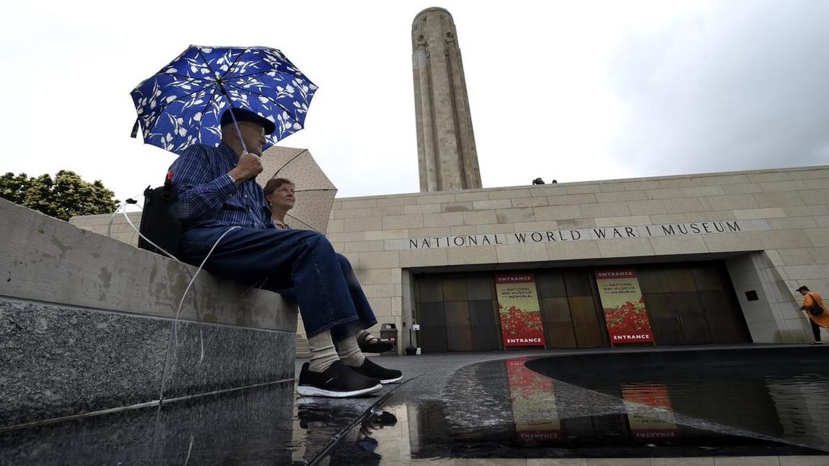 
Continuing rain showers put a damper on Memorial Day weekend festivities, including those in and around the World War I Museum at the Liberty Memorial. Bob Carter, Vietnam veteran, who served in the U.S. Navy from 1962 through 1965, sat with his wife, Pam Carter, as rain fell over the area Sunday afternoon. The couple live in Overland Park.
