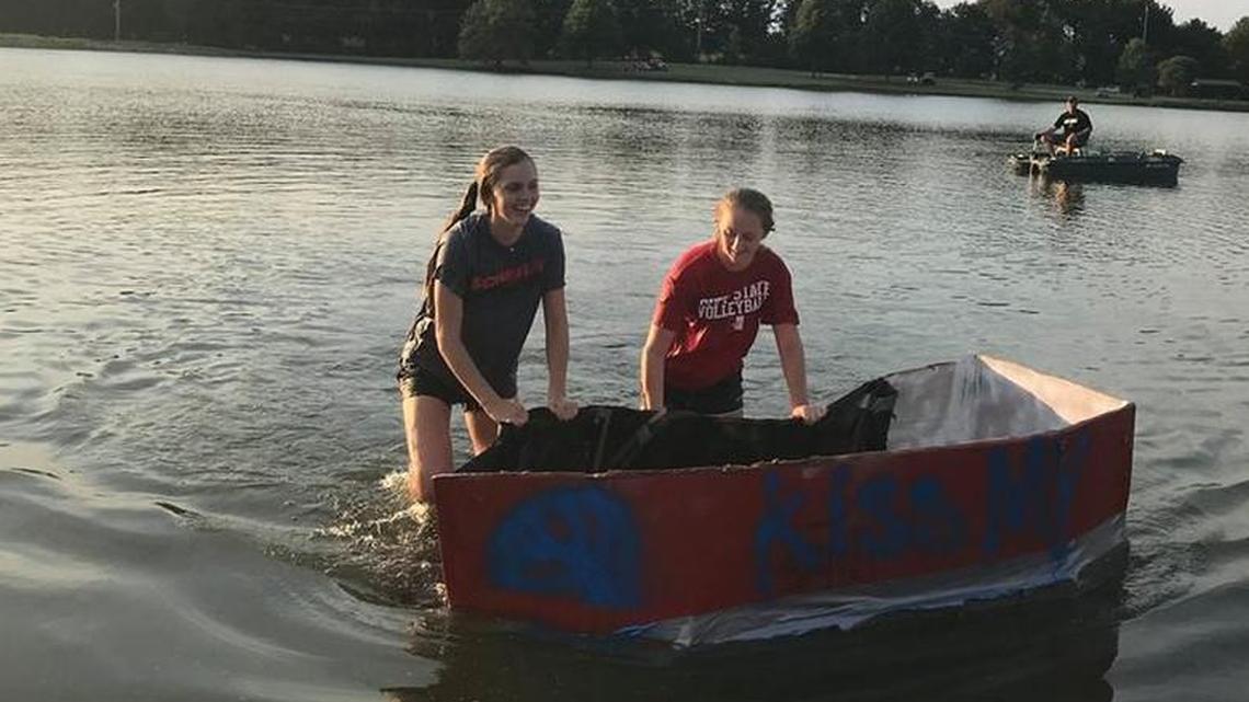 After their paddles gave out, Harrisonville High School juniors Arden Middaugh and Mallory Saffels bring the volleyball team’s boat back to shore.