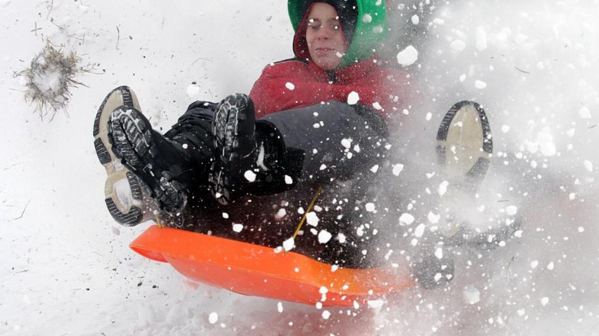 Kansas Citians are not likely to see a white Christmas this year, unlike Christmas 2009 where 5-10 inches of snow fell in the metro area. Max Parker, who was then 7, sent the snow flying as he and his dad Mitch Parker took advantage of the weather at suicide hill in Brookside.