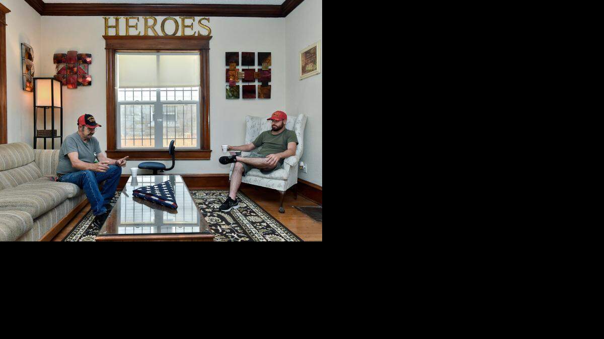 
Vietnam veteran George Turner (left) and Afghanistan veteran Grant Garrison discussed their experiences leading them to Heroes Home Gate, a shelter for homeless veterans in Kansas City that was dedicated Saturday. Turner and Garrison will both live at the new home, which features a larger kitchen than the old house and has a cozy living room. 
