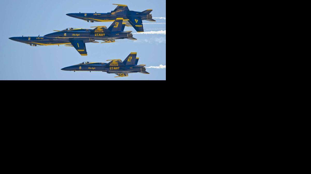 
In this Saturday, March 23, 2013 photo provided by the Florida Keys News Bureau, the U.S. Navy's Blue Angels perform their precision aerobatics over the Florida Keys during the Southernmost Air Spectacular at Naval Air Station Key West near Key West, Fla.
