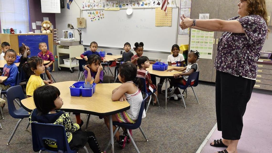 
Faced with increased enrollment, including many new students who require special attention to keep up with grade-level lessons such as English language learners, Kansas City, Kan., schools are among dozens of districts across Kansas seeking Extraordinary Need Fund dollars from the state. At New Chelsea Elementary, kindergarten teacher Ruth DiSilvestro gave students a thumbs-up.
