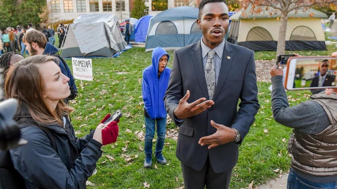 Payton Head, the Missouri Students Association president, answered questions on Sunday during demonstrations at Traditions Plaza on the University of Missouri campus in Columbia. The students, and now a majority of the Missouri football team, are demanding that Tim Wolfe, the president of the Missouri university system, step down or be fired for what they say is a lack of response to a series of racial incidents at the university.