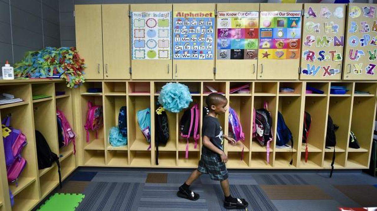 
Peyton Thomas, 5, walked past lockers in his kindergarten class at an early learning center operated at Ervin Junior High School in Kansas City by the Hickman Mills School District. Missouri last week fell short in a bid to win an early childhood education grant from the U.S. Department of Education. 
