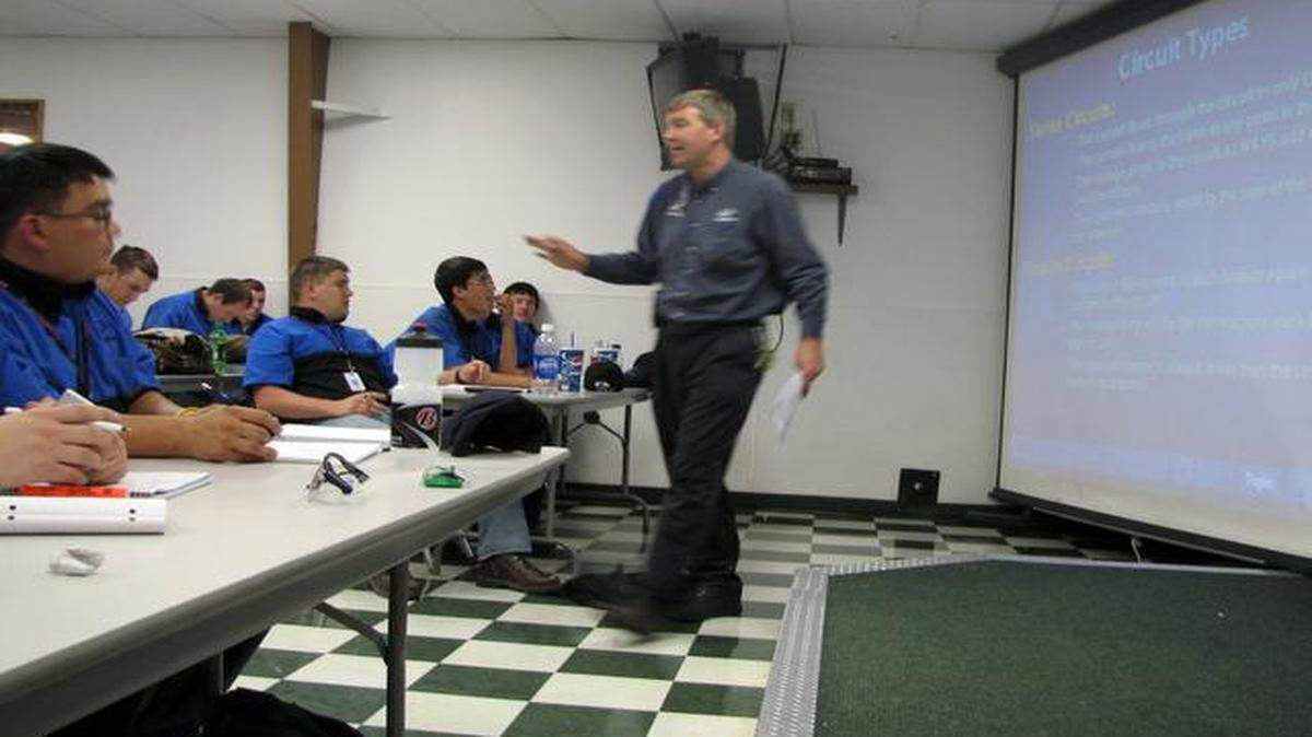 
In this 2009 file photo, Larry Wostenberg teaches an engine management systems class at the WyoTech in Laramie, Wyo., a for-profit institution owned by Corinthian Colleges Inc. Officials said Monday that operations at Everest College at 1740 W. 92nd St. in Kansas City will continue as usual, even though it is among the 85 schools currently listed as being for sale by Corinthian. 
