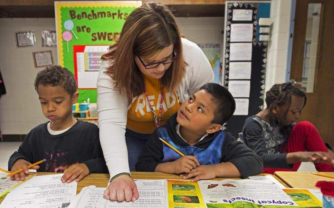 
At Meadowmere Elementary School in Grandview, first-grade teacher Cyndi Lyons recently worked with (from left) Malachi Hamilton, Allan Fuentes-Perez and Samaia Dandy. Lyons, who uses a system of benchmarks to teach math, will begin using benchmarks to teach reading. 


