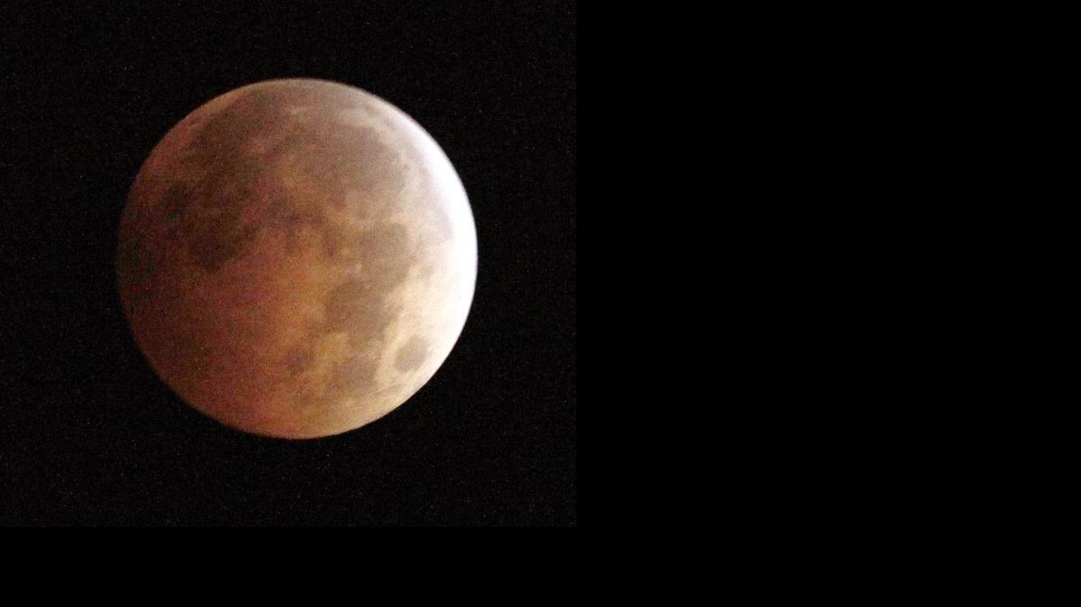 
The Blood Moon, created by the full moon passing into the shadow of the earth during a total lunar eclipse, as seen from Monterey Park, Ca., on Wednesday morning.

