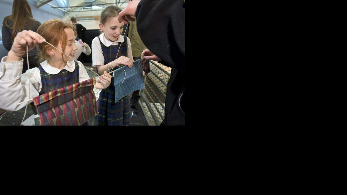 
Mae Dingley (left) and Ellie McManamy, third-graders at Visitation School, worked on a project recently at STEAM Studio at Gould Evans architectural firm.





